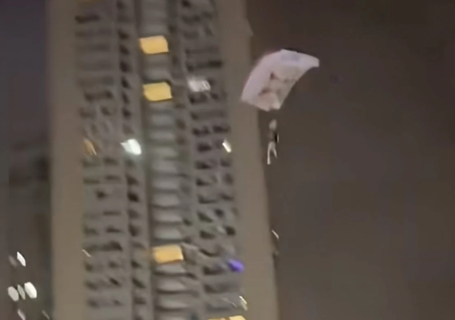 Chinese Man Detained After Stunt Parachute Jump From Residential Tower