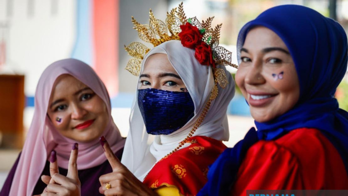 Three Sisters Celebrate Civic Duty With Patriotic Style at Rantau Polling Centre