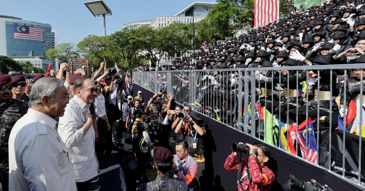 Anwar connects with public after National Day parade in Putrajaya