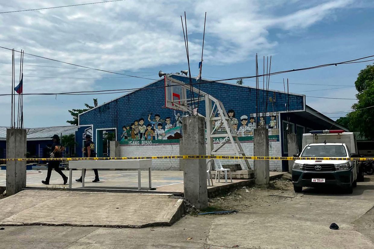 Two teenage students arrested after shooting spree at Philippine high school leaves three dead