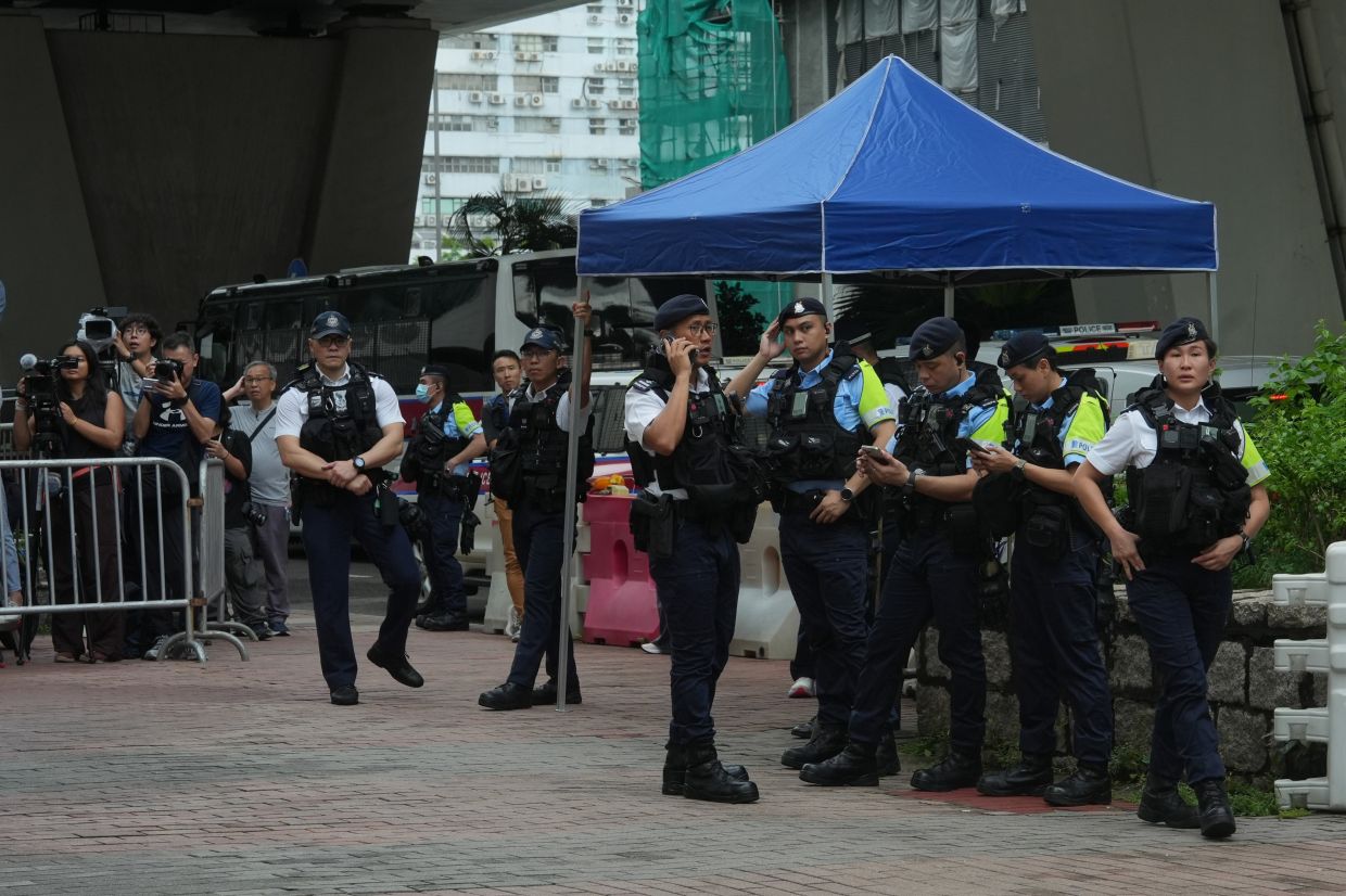 Hong Kong woman arrested for seditious T-shirt as courts tighten grip on dissent