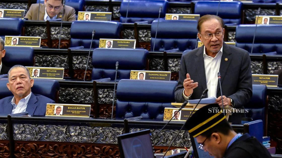 E-wallet Firms Must Fully Compensate Scam Victims if Fraud Controls Fail, Says Anwar