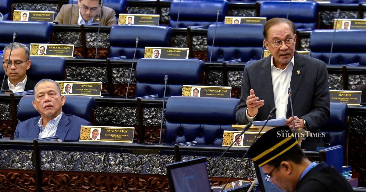 E-wallet Firms Must Fully Compensate Scam Victims if Fraud Controls Fail, Says Anwar