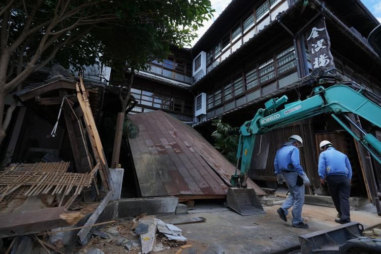 Japan's Kumamoto struggles with dual crisis as heat claims another life in quake aftermath